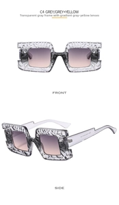 Detail of square oversized sunglasses with hollow pattern frame and gradient lenses