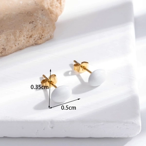 Minimalist white oval stud earrings in stainless steel with a polished jade-like texture