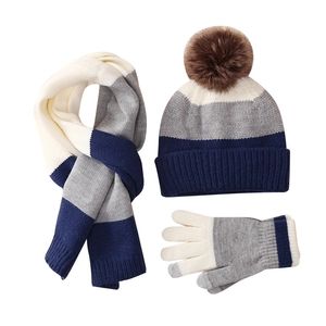 Winter kids knit set including a pompom hat, striped scarf, and gloves in beige and navy