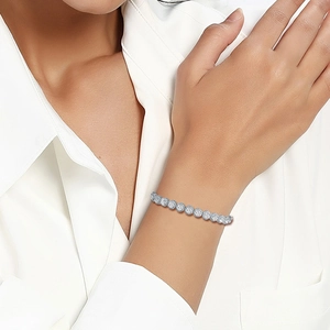 Close-up of high-quality silver tennis bracelet with cubic zirconia on a wrist