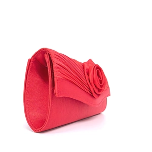 Detail of red satin evening clutch bag featuring handmade 3D roses and pleated texture