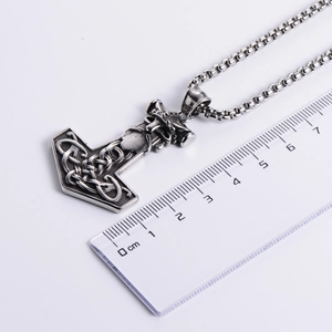Nordic Viking Mjolnir pendant in antique silver with size measurements on ruler