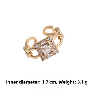Detail view of gold zircon ring showing 1.7cm inner diameter and 3.1g weight specification