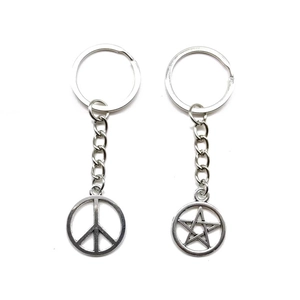 Vintage silver alloy peace sign and five-pointed star keychains for bags or cars