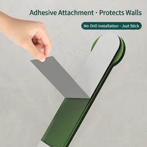 Self-adhesive dark green wall hook for bathroom, no-drill installation on marble walls