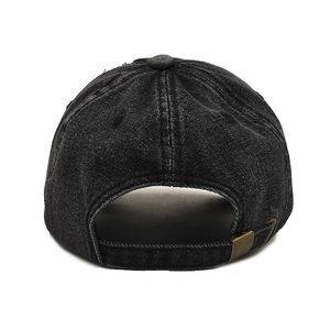 Rear view of black washed denim cap showing vintage bronze metal buckle adjustment