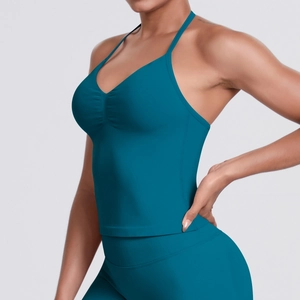 Detailed side view of peacock blue seamless ribbed yoga sports top with V-neckline design