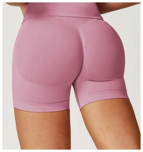 Detail showing high waist pink yoga shorts with seamless peach butt lifting design