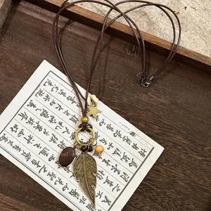 Bohemian wood bead necklace with bronze feathers and star pendant, 68cm long with extension