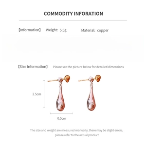 Detail view of gold-plated copper drop earrings with 925 silver needles and size specs