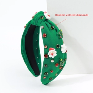 Detail of green Christmas headband with Santa, tree, snowflakes and colorful rhinestones