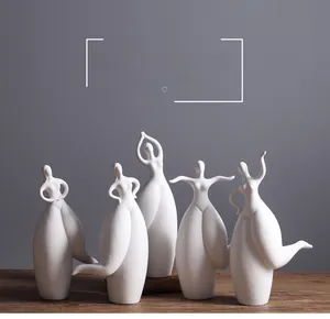 Detailed view of 5-piece minimalist white ceramic abstract dancing girl sculptures