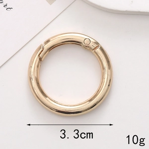 Close-up of golden metal spring o-ring snap hook 3.3cm size and 10g weight details