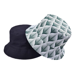 Reversible bucket hat set with solid black and green leaf pattern print for sun protection