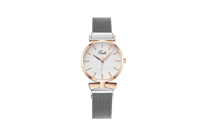 Detailed macro of a women's quartz watch with silver Milanese band and leaf textured dial