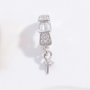 Close-up of S925 silver pendant clasp with clear rhinestones and needle mount structure