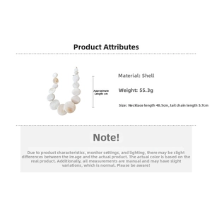 Detail of shell necklace showing white shell discs and 5.7cm adjustable metal tail chain