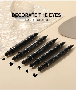 Detail of 5 double-ended eyeliner pens with star, heart, and flower stamp tips