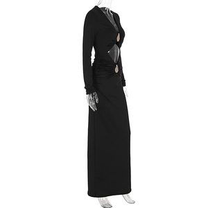 Detail of waist cut-out with golden rhinestone accents on a slim black maxi dress