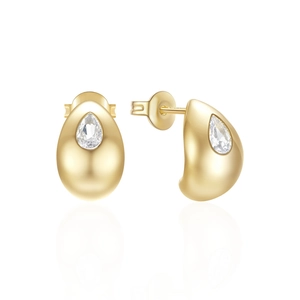 Macro detail of drop-shaped gold earrings with teardrop zirconia insets on white background