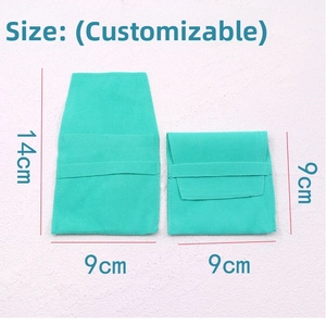 Close-up of velvet jewelry pouches in Tiffany blue with flap and drawstring closure