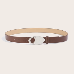 Detail of a brown faux leather belt featuring a hollow oval silver metal buckle