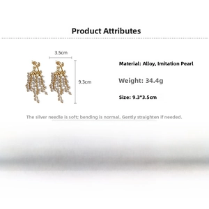 Detail showing dimensions and material of golden maple leaf pearl tassel earrings