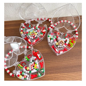 Detailed view of Christmas themed kids hair accessories set in a heart-shaped gift box