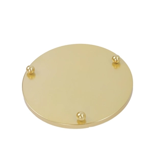 Detailed view of a golden circular metal base jewelry stand with three ball feet supports