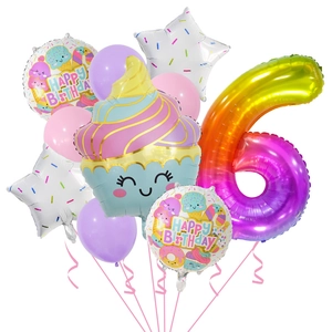 Detail of rainbow gradient number 6 balloon with cupcake and stars for birthday party decor
