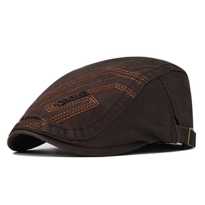 Detail view of cotton flat cap with geometric stitching and adjustable metal side buckle