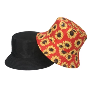 Detailed view of stitching on black and sunflower print reversible cotton bucket hats