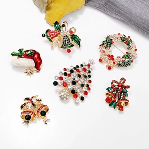 Christmas themed brooch set with enamel reindeer and bells featuring sparkling rhinestones