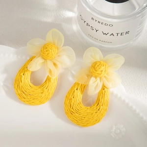 Handmade raffia hoop earrings with yellow mesh flower for bohemian summer vacation style