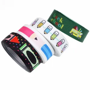 Detail of Back to School grosgrain ribbon with pencil and school bus prints for DIY crafts