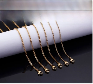 Macro shot of six gold-plated stainless steel chains with secure lobster clasps