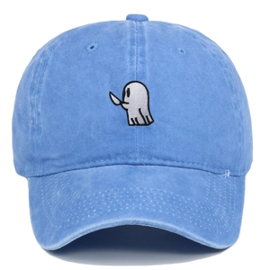Detail of white ghost embroidery with dagger on blue washed cotton baseball cap texture
