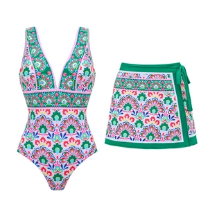 Detail of vibrant mandala print swimwear with deep V-neck and matching tie-up skirt