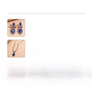 Detail showing bow knot earrings and pearl necklace with blue gemstone drops and rhinestones