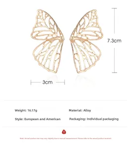 Detailed view of hollow butterfly earrings in gold finish with size and weight specs