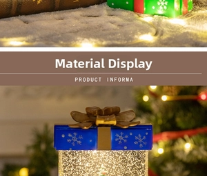 Close-up of a blue Christmas gift box lantern with snowflake prints and golden bow
