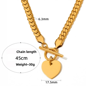 Detail of 6.3mm gold Cuban link chain with 17.5mm heart pendant and OT toggle clasp