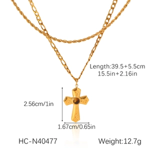 Detailed specs of gold double Figaro chain necklace with gemstone cross pendant