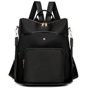 Minimalist black waterproof nylon backpack with golden zippers and leather trim
