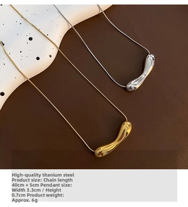 Detail of irregular liquid metal pendant on delicate titanium steel snake chain