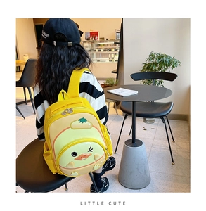 Toddler girl wearing a 3D yellow cartoon duck backpack with side mesh pockets