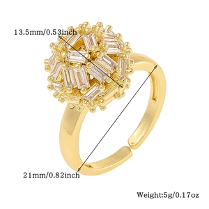 Detail view of adjustable gold ring with clear cubic zirconia spheres and size dimensions
