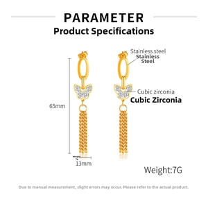 Detail view of long gold tassel earrings with cubic zirconia butterfly and stainless steel finish