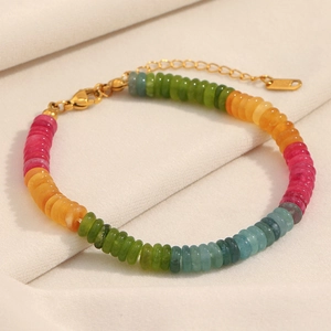 Macro detail of natural stone beaded bracelet with 18K gold plated lobster clasp and chain
