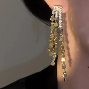 Sparkling gold tassel earrings with zircon studs and dangling sequins for women
